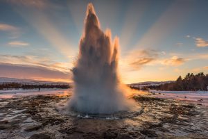 Geysir erupting on a Golden Circle Tour by AURORA REYKJAVÍK