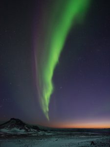 Aurora over a snowy landscape