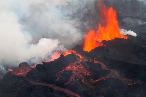 A volcano erupting lava Description automatically generated with low confidence