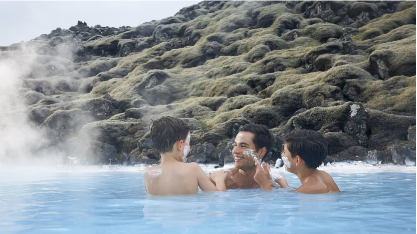 Father and sons relaxing at the Blue Lagoon