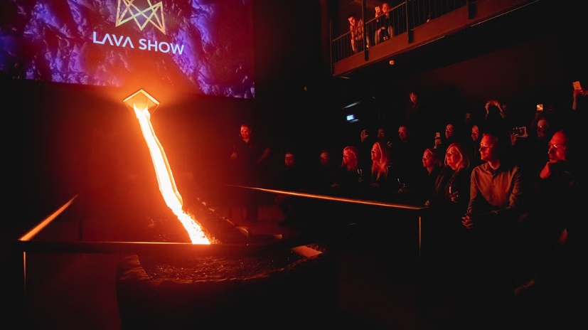 Visitors watching real lava flow in the Lava Show auditorium