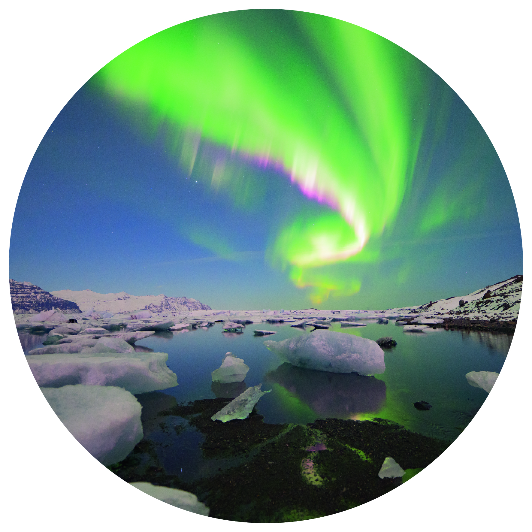 Bright green and pink northern lights reflect in water and ice formations of the glacier lagoon, with the glacier in backdrop