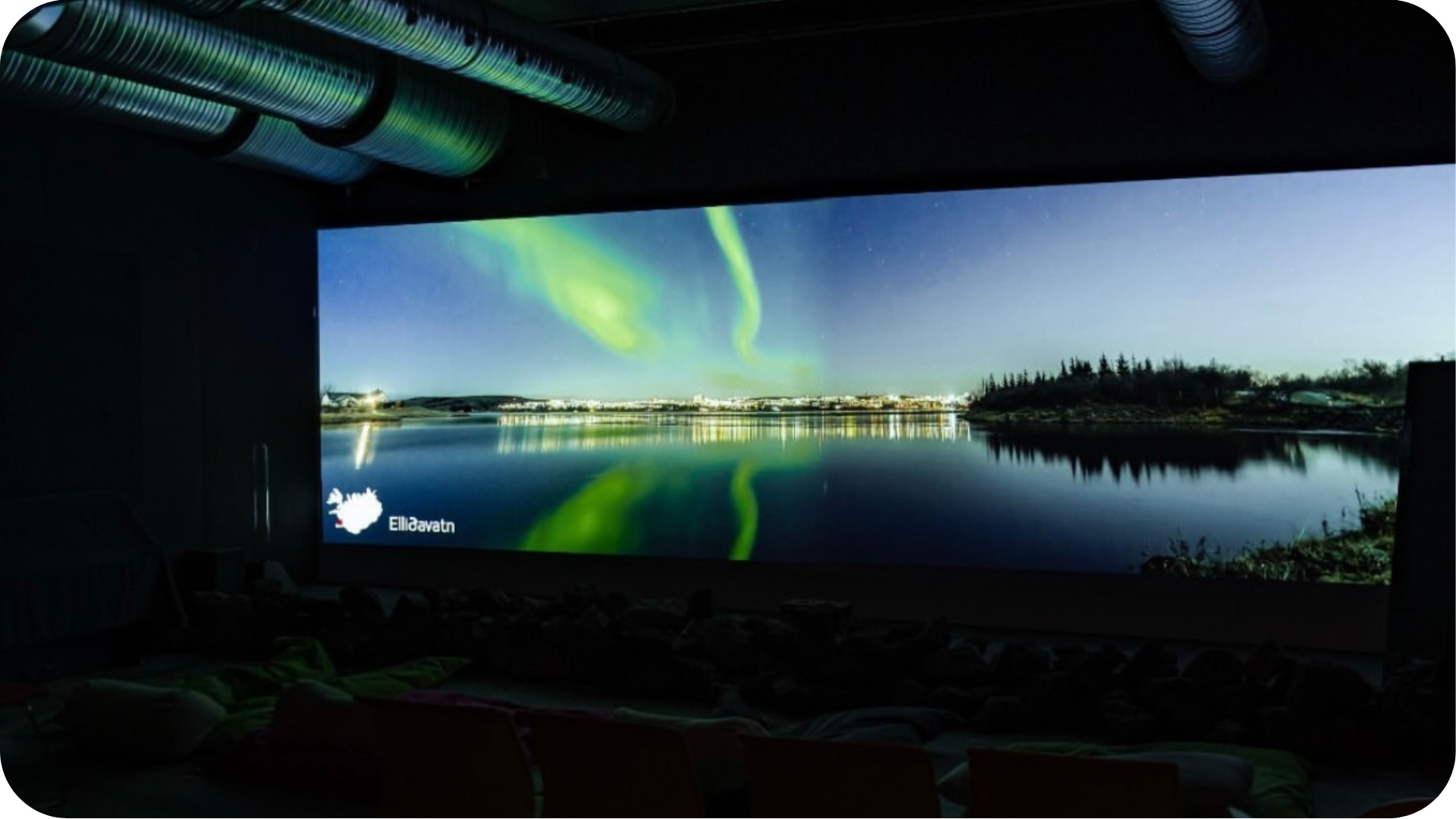 A visitor experiencing the Northern Lights in virtual reality at Aurora Reykjavík, The Northern Lights Center in Reykjavík, Iceland
