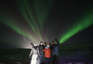 Travellers enjoying the northern lights