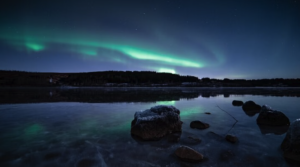 Northern lights reflecting in a pond