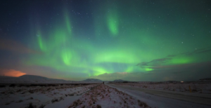 Northern lights over a country road