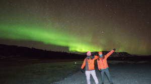 Travellers enjoying the northern lights