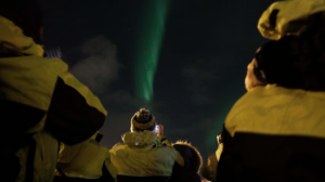 Passengers photographing the northern lights