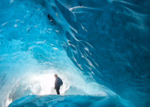 Traveller in a natural ice cave