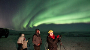 Visitors adjusting cameras