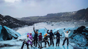 Explorers posing on a glacier hike