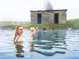 Visitor enjoying a drink at Secret Lagoon