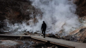 Traveller walking through the Seltún geothermal area