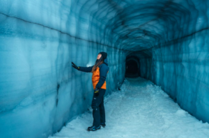 Traveller exploring the ice cave