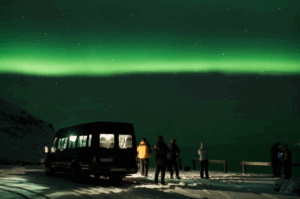 Travellers enjoying the northern lights